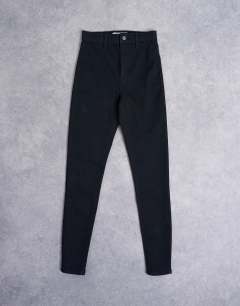 Model wearing Joni skinny high rise jean in black