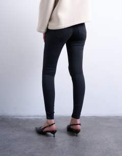 Model wearing Joni skinny high rise jean in washed black