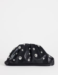 Model wearing Josephine small studded clutch bag in black