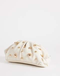Model wearing Josephine small studded clutch bag in off white