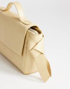 Model wearing Josie small grab knot detail grab bag in buttermilk