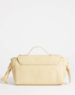 Model wearing Josie small grab knot detail grab bag in buttermilk