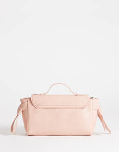 Model wearing Josie small grab knot detail grab bag in pink