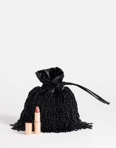 Model wearing Josy small beaded pouch grab bag in black