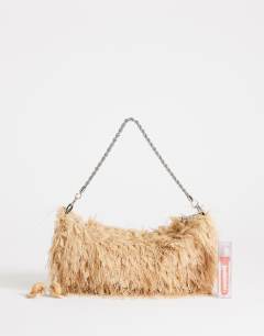Model wearing Juliet small fringe grab bag in champagne