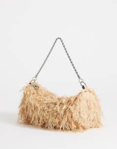 Model wearing Juliet small fringe grab bag in champagne