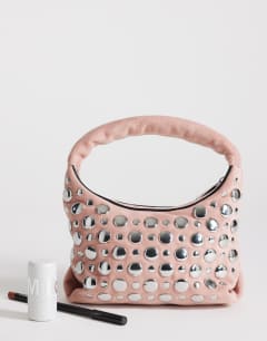 Model wearing Juno small studded grab bad in pink