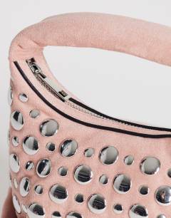 Model wearing Juno studded grab bad in pink
