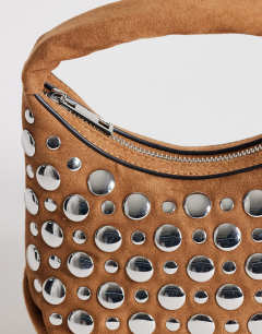 Model wearing Juno studded grab bag in tan