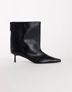 Model wearing Kai super wide heeled ankle boot in black