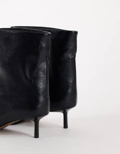 Model wearing Kai super wide heeled ankle boot in black