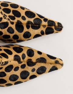 Model wearing Kai super wide heeled ankle boot in leopard pony hair on real leather