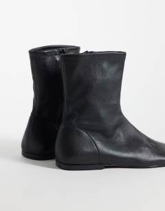 Model wearing Kameron real leather flat ankle boot in black