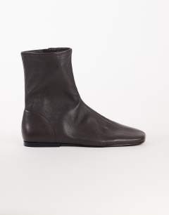Model wearing Kameron real leather flat ankle boot in chocolate
