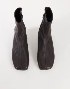 Model wearing Kameron real leather flat ankle boot in chocolate