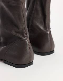 Model wearing Kameron real leather flat ankle boot in chocolate