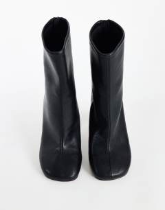 Model wearing Kendal structured heel sock boot in black