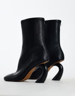 Model wearing Kendal structured heel sock boot in black