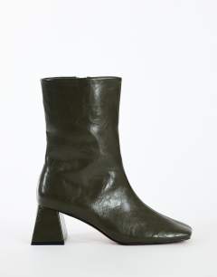 Model wearing Kenton block heel ankle boot in khaki