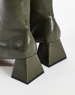 Model wearing Kenton block heel ankle boot in khaki