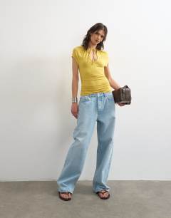 Model wearing Keyhole detail top in ochre