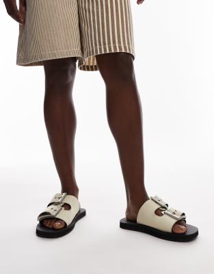 Kiara leather sandals with chunky buckles in off white