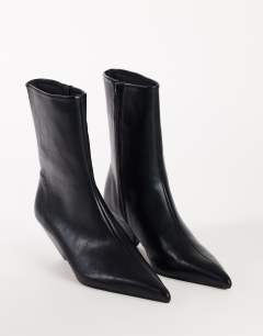 Model wearing Kiki cone heel ankle boot in black