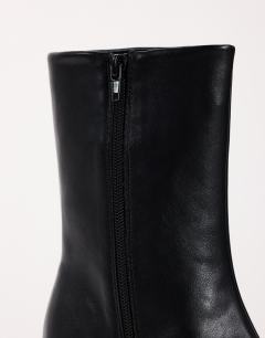 Model wearing Kiki cone heel ankle boot in black