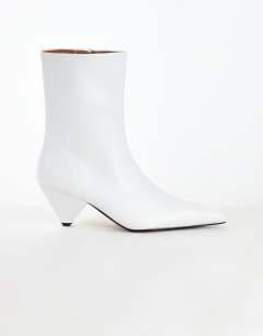 Model wearing Kiki cone heel ankle boot in off white