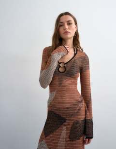 Model wearing Knitted abstract mesh long sleeve maxi dress in burnt orange