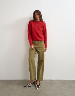 Model wearing Knitted all needle shoulder padded jumper in red