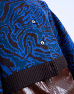 Model wearing Knitted animal print cardigan in blue