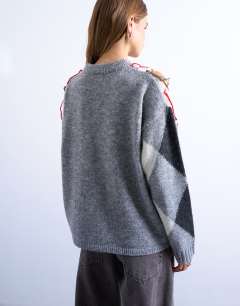 Model wearing Knitted argyle distressed jumper