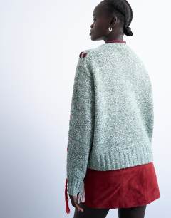 Model wearing Knitted argyle embroidered jumper in green