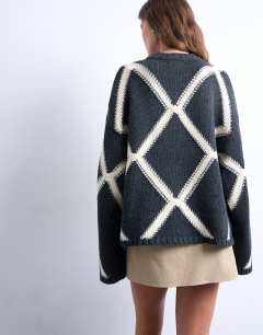 Model wearing Knitted argyle jumper in charcoal