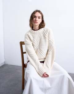 Model wearing Knitted argyle jumper in cream