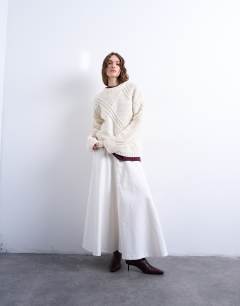 Model wearing Knitted argyle jumper in cream