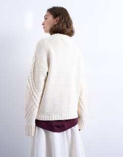 Model wearing Knitted argyle jumper in cream