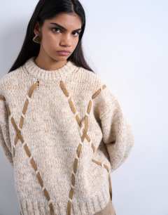 Model wearing Knitted argyle jumper with suede strap detailing in brown
