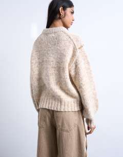 Model wearing Knitted argyle jumper with suede strap detailing in brown