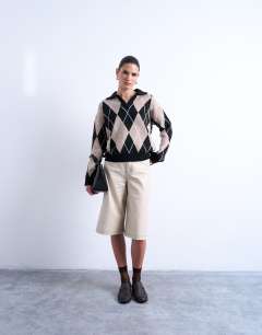 Model wearing Knitted argyle polo in neutral