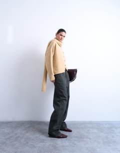 Model wearing Knitted asymmetric cardigan with scarf in oat beige