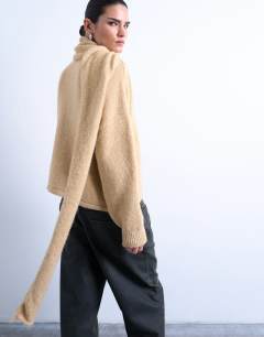 Model wearing Knitted asymmetric cardigan with scarf in oat beige
