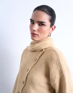 Model wearing Knitted asymmetric cardigan with scarf in oat beige