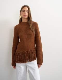 Model wearing Knitted asymmetric fringe jumper in gingerbread
