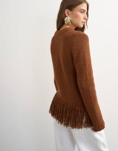 Model wearing Knitted asymmetric fringe jumper in gingerbread