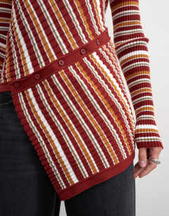 Model wearing Knitted asymmetric longline ribbed stripe top in red