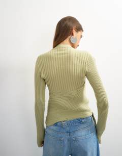 Model wearing Knitted asymmetric longline ribbed top in pistachio