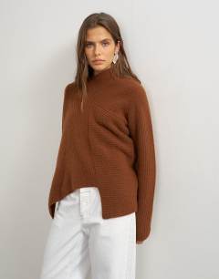 Model wearing Knitted asymmetric panel jumper in gingerbread