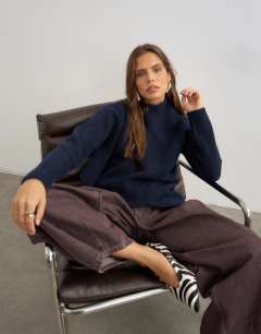 Model wearing Knitted asymmetric panel jumper in navy
